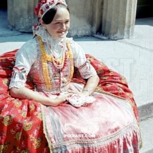 Beautiful Hungarian women in local festive costume. Hungary 1942. Hungry flag in ribbons on arm.
