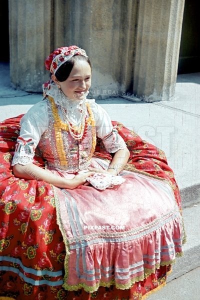 Beautiful Hungarian women in local festive costume. Hungary 1942. Hungry flag in ribbons on arm.