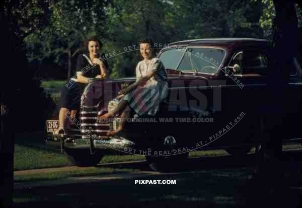 Beautiful women sit on classic car with OHIO plates USA 1940 21-XG-OHIO-1940