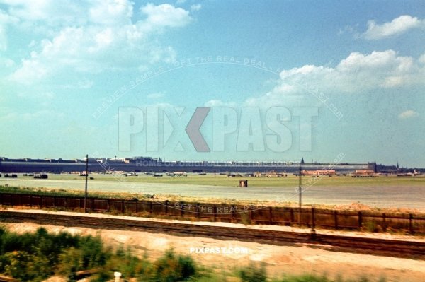 Bomber planes and fighters parked at front of temporary wooden houses in Berlin Tempelhof Airport. Berlin 1941