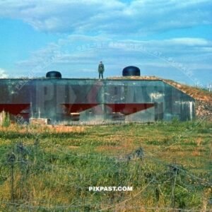 Captured French Maginot Machine Gun Bunker. France July 1940. Barbed wire fence in machine gun MG field
