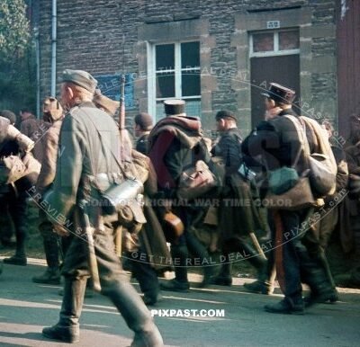 Captured French Military POW soldiers and military police men escorted back to German border. Belgium 1940