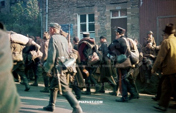 Captured French Military POW soldiers and military police men escorted back to German border. Belgium 1940