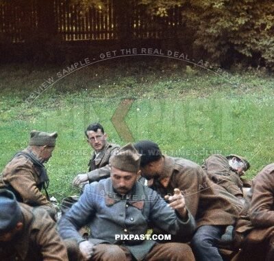Captured French Military POW soldiers and military police men escorted back to German border. Belgium 1940