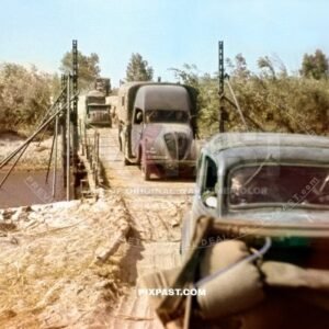 Captured French army Peugeot trucks and Opel Olympia crossing pontoon bridge Russia 1941. 297 Infantry Division