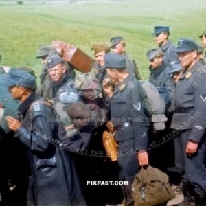 Captured German Luftwaffe soldiers walking through Murnau Bavaria Germany 1945. 101st Cavalry Regiment USA. POW