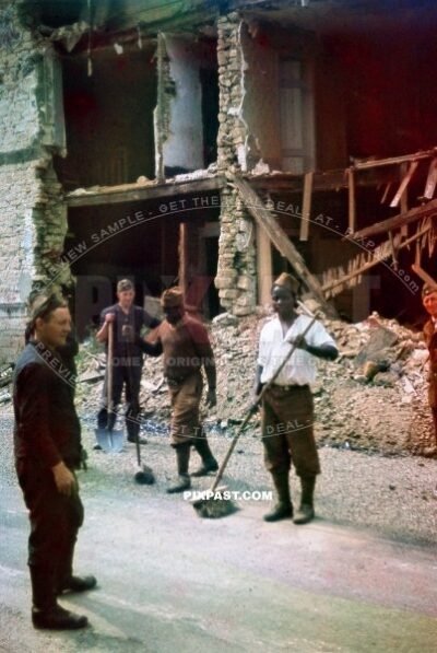 Captured POW French Colonial African troops doing forced labor. Road cleaning. Verdun France 1940