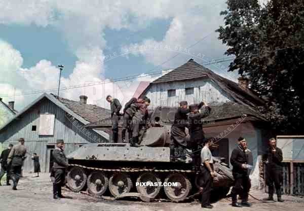 Captured Russian Soviet T34 tank in Dubno Lutsk Brody, Ukraine 1941. Inspected by German Luftwaffe ground troops.