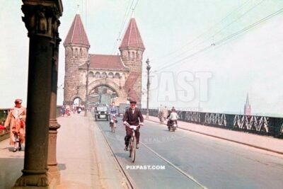 Cars, pedestrians and cyclists on the old Alt Bonn Rhinebrucke Germany 1938. Bridge destroyed in 1945 on the Rhine
