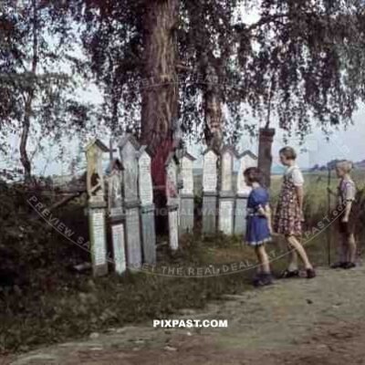 Children reading religious plaques near Pottenstein, Germany 1939