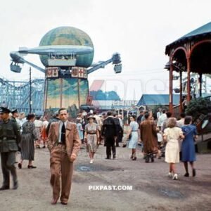 Civilians and soldiers enjoying the arcade games in Parkfest Treptow 1941.  Zeppelin Karussell ride