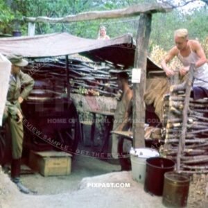 Cook wearing tropical uniform cooking with camouflaged thatch Gulaskanone. Bunker Ukraine 1942