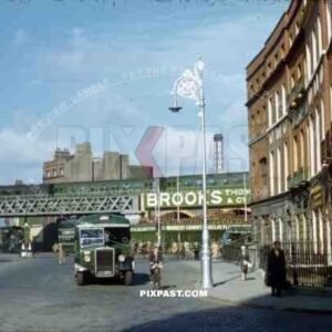 Corner of Store Street and Beresford Place, Dublin, Ireland, 1953, Green Bus, old cars, Dart Station, train