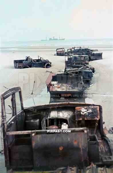 Destroyed British army trucks lying on the beaches of Dunkirk after the evacuation of the British Expeditionary Force May 1940