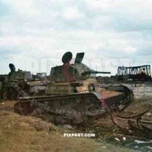 Destroyed Soviet Russian T 26 light infantry tank and a BT 7 cavalry tanks in train station. Russia 1941.
