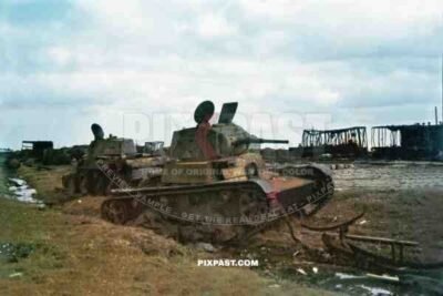 Destroyed Soviet Russian T 26 light infantry tank and a BT 7 cavalry tanks in train station. Russia 1941.