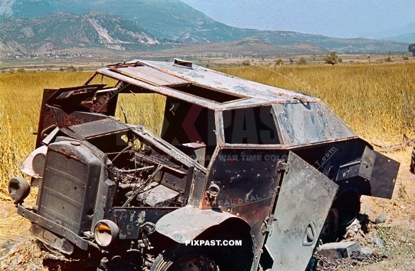 Destroyed captured by Germans, British armored car Morris Commercial C8 FAT in battlefield Greece 1942