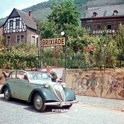 Driving tour 1937 Stoewer Greif Junior Cabriolimousine in front of Brixiade Hotel in Cochem direct on the Moselle Germany 1937