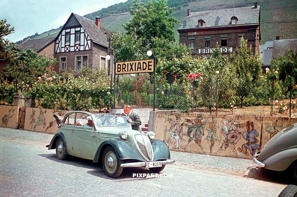 Driving tour 1937 Stoewer Greif Junior Cabriolimousine in front of Brixiade Hotel in Cochem direct on the Moselle Germany 1937