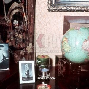 Family sitting room Germany 1939. With World Globe and framed portrait of Sailor son. Segelschulschiff Horst Wessel