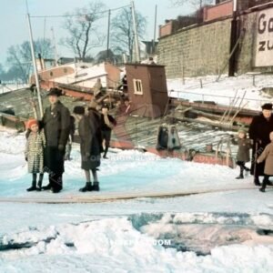 Father with his daughter on a frozen Elbe river beside a frozen car ferry. Gasthaus zur Fahre Curt Streidl. Dresden 1940