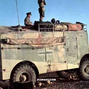 Field Marshal Erwin Rommel watching battlefield 1941 Tunisia in Captured British armoured truck MAX. MAMMUT