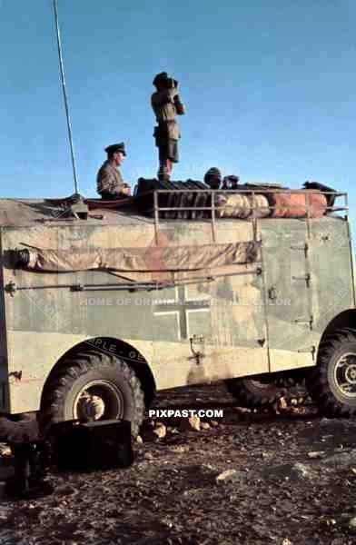 Field Marshal Erwin Rommel watching battlefield 1941 Tunisia in Captured British armoured truck MAX. MAMMUT