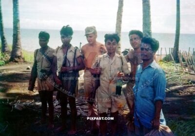 Filipino Resistance Guerrillas receiving American weapons and training to fight Japan.  New Guinea during 1944