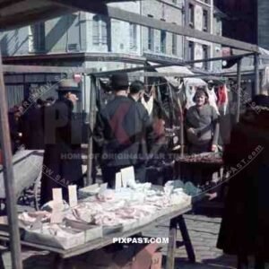 Food and Flea Market behind Notre Dame Cathedral, Paris, France, 1940.
