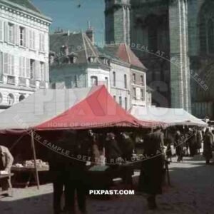 Food and Flea Market behind Notre Dame Cathedral, Paris, France, 1940.