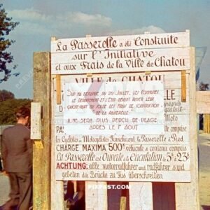 French and German construction road sign warning users about bomb damage to the main bridge in Loreans France 20.6.1940