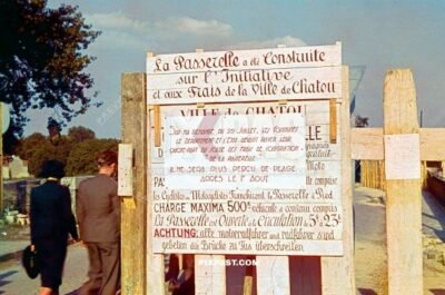 French and German construction road sign warning users about bomb damage to the main bridge in Loreans France 20.6.1940