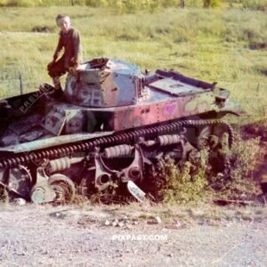 French children playing on abandoned small French Renault AMR 33/35, french light cavalry tank, France, 1940.