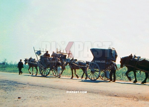 French civilian refugees transporting their last possessions by horse cart out of heavily bombed Verdun France July 1940