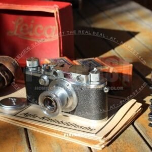 German 1934 Leica III camera with Elmar 5cm F3,5 lense. Original leather bag and Leica red box.