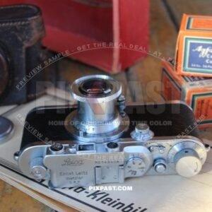 German 1934 Leica III camera with Elmar 5cm F3,5 lense. Original leather bag and Leica red box.