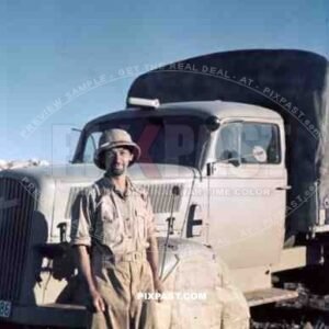 German Afrika Korp soldier in front of a supply truck, North Africa 1942