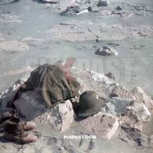 German Afrika Korp soldiers go swimming in the Mediterranean Sea after arriving in Libya 1941. Uniform laying on the beach