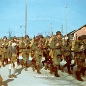 German Infantry Regiment wearing M18 helmets marching in Alt Otting in Bavaria Bayern Germany 1940