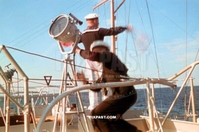 German Kriegsmarine matrose training with signal flags on a minelayer ship in Lubeck Harbour Germany 1939 Ost See
