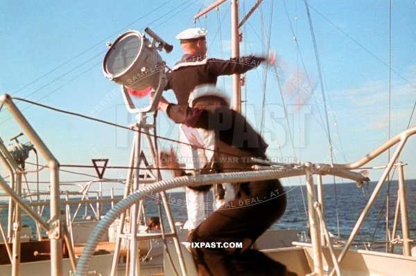 German Kriegsmarine matrose training with signal flags on a minelayer ship in Lubeck Harbour Germany 1939 Ost See