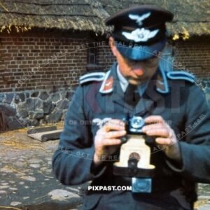 German Luftwaffe FLAK Private soldier holding his 35mm camera in a Polish village Poland 1939