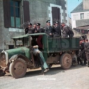 German Luftwaffe FLAK soldiers practicing launching anti aircraft balloons. stand in a french truck. France 1940