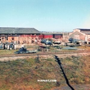 German Luftwaffe air plane repair workshop beside the train lines. Poland 1944 Bomber planes and wing parts being repaired