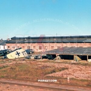 German Luftwaffe air plane repair workshop beside the train lines. Poland 1944 Bomber planes and wing parts being repaired