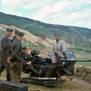 German Luftwaffe anti aircraft flak crew manning their 2 cm Flak 38 cannon. different national flags hits. Greece 1942