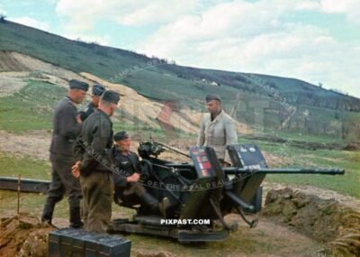 German Luftwaffe anti aircraft flak crew manning their 2 cm Flak 38 cannon. different national flags hits. Greece 1942