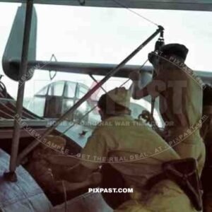 German Luftwaffe crew in tropical uniform load a Seaplane Dornier Do 24, Tripoli harbour in Libya, 1942.