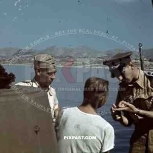 German Luftwaffe crew in tropical uniform load a Seaplane Dornier Do 24, Tripoli harbour in Libya, 1942.
