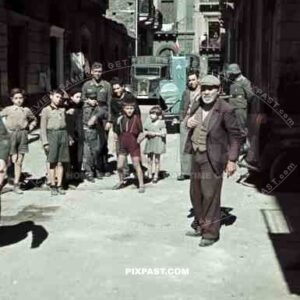 German Luftwaffe soldier personnel street shops car truck lorry helmet children kids grandad poor houses buildings Greece 1942